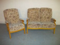 A TWO PIECE SUITE COMPRISING TWO SEATER SOFA AND A CHAIR