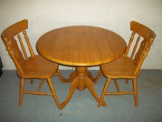 A MODERN DINING SET WITH TWO CHAIRS