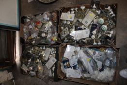 FOUR TRAYS OF FURNITURE HANDLES ETC