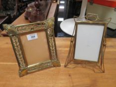 A VINTAGE EASEL BACKED PIERCED BRASS PICTURE FRAME' TOGETHER WITH ANOTHER (2)