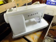 A CASED VINTAGE SINGER SEWING MACHINE