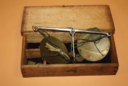 AN OAK CASED SET OF ANTIQUE SCALES & WEIGHTS