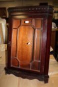A REPRODUCTION MAHOGANY GLAZED HANGING CORNER CABINET