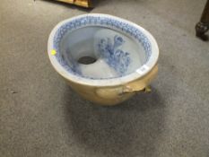 AN ANTIQUE BLUE AND WHITE BIDET BOWL? WITH CHERUBIC DETAIL A/F