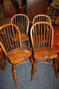 A MODERN SET OF FOUR OAK HOOP BACK CHAIRS