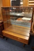 A RETRO MID CENTURY TEAK GLAZED BOOKCASE H-133 CM W-106 CM