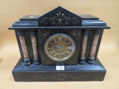 A VINTAGE SLATE MANTEL CLOCK WITH COLUMN DETAIL