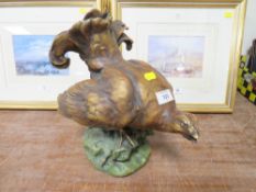 AN ANTIQUE CERAMIC FIGURE OF A GROUSE S/D