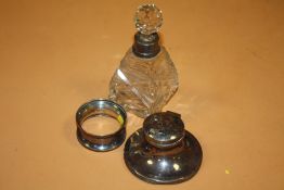 A SMALL HALLMARKED SILVER CAPSTAIN INKWELL' TOGETHER WITH A SILVER NAPKIN RING AND A SILVER