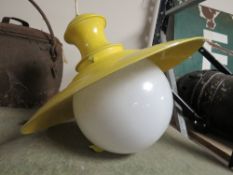 A RETRO STYLE YELLOW CEILING LIGHT
