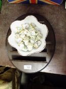 A COLLECTION OF FRANKLIN PORCELAIN THIMBLES ON WOODEN DISPLAY STAND