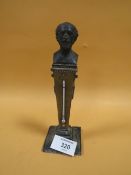 AN ANTIQUE BRONZED DESK TOP BAROMETER WITH BUST TO TOP S/D