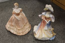 A ROYAL DOULTON 'LADY DOULTON' TOGETHER WITH A COALPORT FIGURE (2)