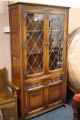 AN OAK OLD CHARM LEADED BOOKCASE H-184 CM W-100 CM