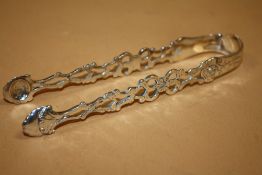 A PAIR OF ANTIQUE HALLMARKED SILVER SUGAR TONGS