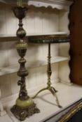AN ONYX AND GILT FIGURAL TALL LAMP WITH A SIMILAR PEDESTAL TABLE (2)