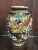AN ORIENTAL JAPANESE FIGURATIVE VASE WITH MARKERS TO BASE