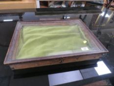 A GLAZED TABLETOP DISPLAY CASE