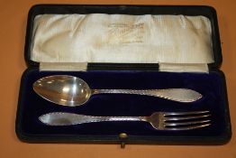 A BOXED HALLMARKED SILVER SPOON AND FORK SET