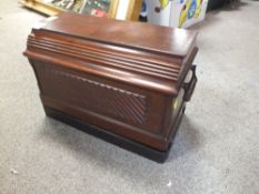 A VINTAGE MAHOGANY CASED SINGER SEWING MACHINE