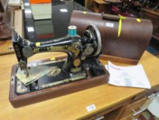 A MAHOGANY CASED SINGER SEWING MACHINE