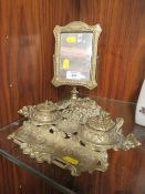A GREEN MAN SHAPED BRASS DESK STAND TOGETHER WITH A BRASS SWING MIRROR (2)
