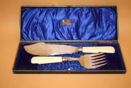 A CASED SET OF ANTIQUE FISH SERVERS