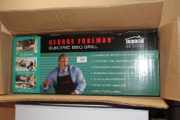 A BOXED GEORGE FOREMAN ELECTRIC BBQ GRILL