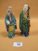 A PAIR OF ORIENTAL STYLE FIGURES STAMPED CHINA TO BASE