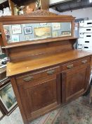 AN ANTIQUE MIRRORBACKED CHIFFONIER H - 181 CM W - 137 CM