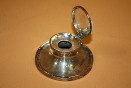 AN ANTIQUE SILVER CAPSTAN INKWELL