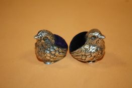 A PAIR OF HALLMARKED SILVER NOVELTY PIN CUSHIONS