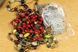 A BAG OF ASSORTED COSTUME JEWELLERY