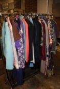 A RAIL OF LADIES VINTAGE CLOTHING' VARIOUS STYLES AND PERIODS TO INC 1970S AND 1980S ETC (APPROX 55)