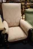AN ANTIQUE MAHOGANY FRAMED SCROLL ARM ARMCHAIR