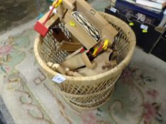 A BASKET OF WOODEN BRIO TRAIN TOYS