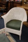 AN ORIGINAL LLOYD LOOM ARMCHAIR WITH UPHOLSTERED SEAT CUSHION