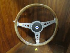 A VINTAGE FORD MOTO-LITA CAR STEERING WHEEL