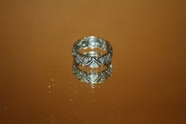 A VINTAGE 9CT GOLD AND SILVER ETERNITY RING