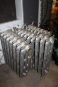 A VICTORIAN STYLE FOUR PIECE CAST RADIATOR