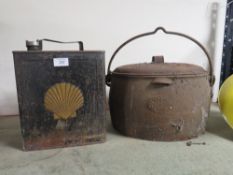 A VINTAGE CAST METAL COOKING POT AND A VINTAGE SHELL OIL CAN