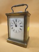 AN ANTIQUE FRENCH BRASS CARRIAGE CLOCK