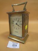 AN ANTIQUE FRENCH BRASS CARRIAGE CLOCK