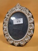 A HALLMARKED SILVER MOUNTED PICTURE FRAME