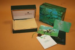AN EMPTY ROLEX OYSTER WATCH BOX WITH CERTIFICATES