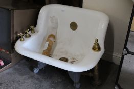 A BIDET ON CAST BALL AND CLAW FEET