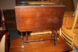 AN ANTIQUE MAHOGANY SUTHERLAND TABLE