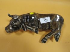 AN ANITA HARRIS FIGURE OF A COW SLEEPING