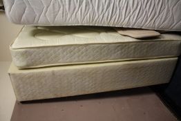 A MODERN SINGLE BED BASE AND MATTRESS