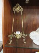 A LARGE EDWARDIAN BRASS PICTURE EASEL